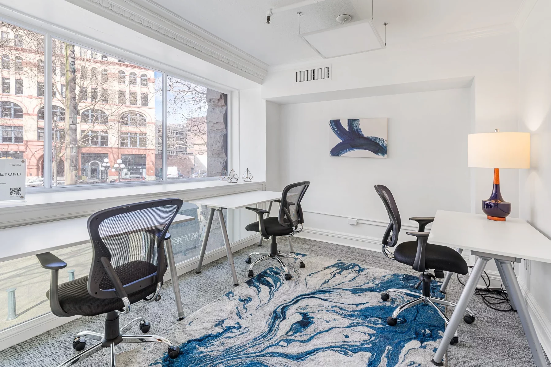 Modern office building interior with welcoming shared areas and access to private work suites