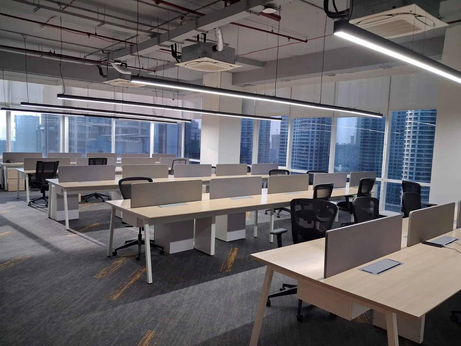 Business professionals discussing office requirements and workspace arrangements